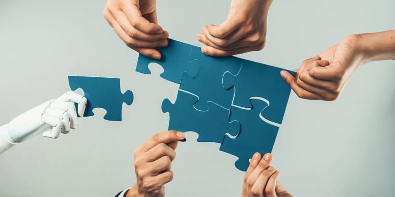 A series of different hands connecting different puzzle pieces.