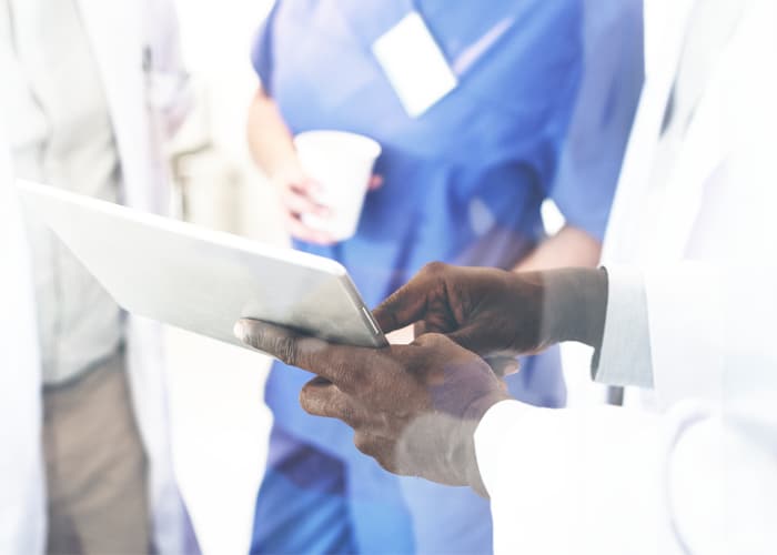 group of doctors having discussion digital tablet