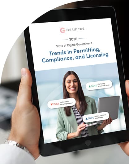 A person holds a tablet displaying Granicus' 2026 