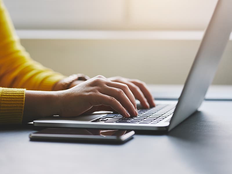 Government IT professional in her office on her laptop