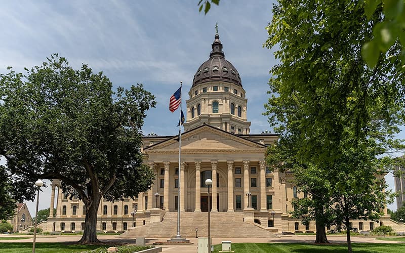 Front view of the Kansas State Capitol building, representing statewide coordination and public service infrastructure.