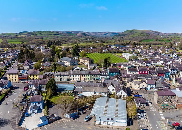 An aerial view of homes and greenery in Carmarthenshire County.
