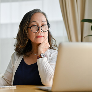 woman in office using laptop