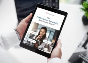 Male government employee reviewing the Granicus 2025 Public Records Complexity Benchmark Report on a tablet.