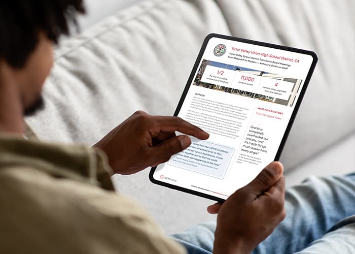 A person scrolling through the Victor Valley School District success story on an iPad.