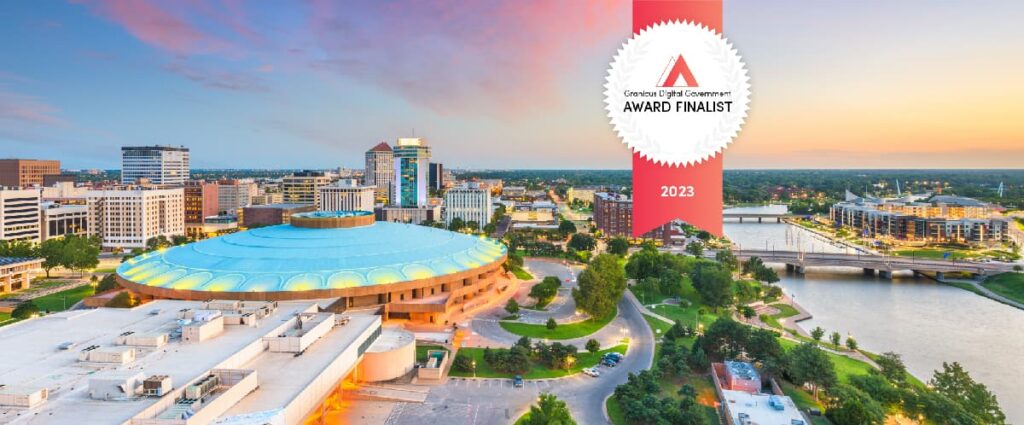 Granicus Digital Award finalist badge overlaying a picture of downtown Wichita, KS at sunset