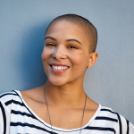 young woman smiling blue background