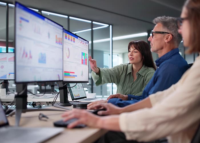 Team Analyzing Performance Data Using KPI Dashboard