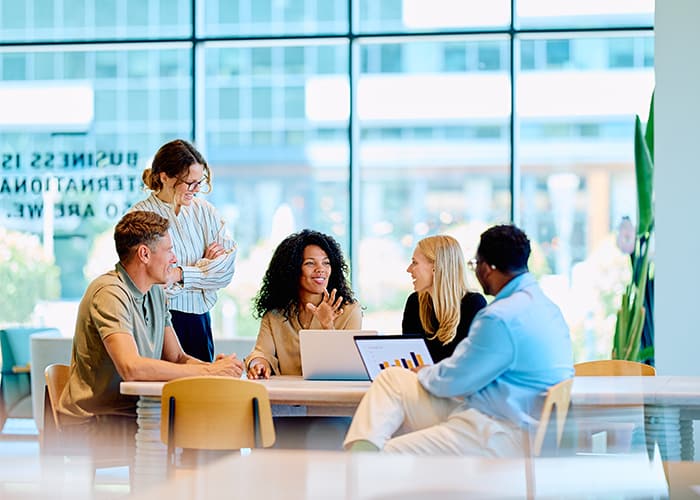 Multiracial business professionals discussing project during meeting