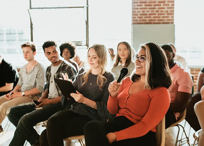 Community meeting, young woman asking a question