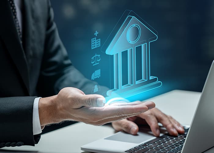 Businessman using a laptop while showing a government icon