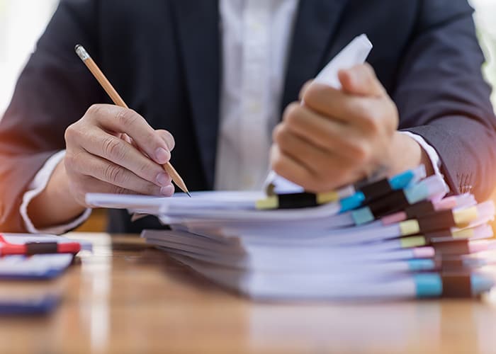 Office employee working with documents at the table workplace