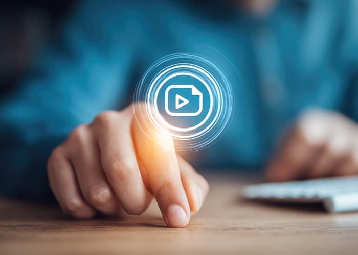 Hand interacting with a video file icon