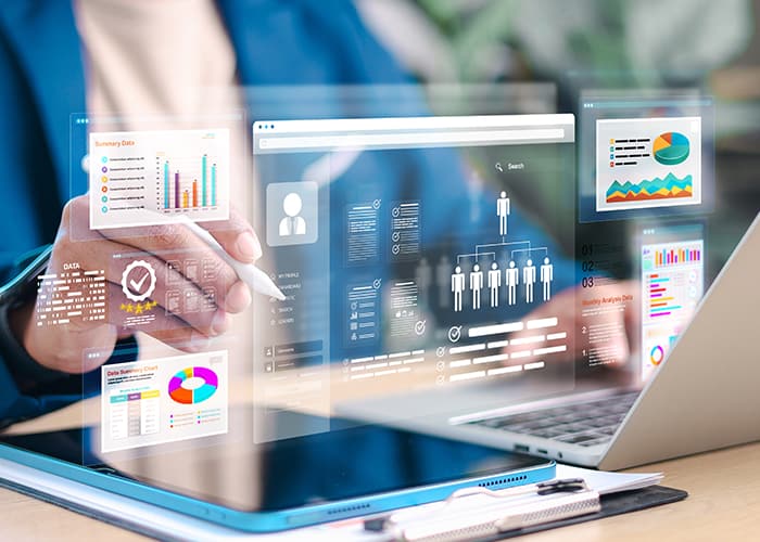 Business professional analyzing data and dashboards on digital devices