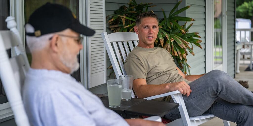 Image of two military veterans, a father and son, highlighting the importance of personalized digital service strategies tailored to different life stages.