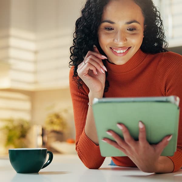 Government professional engaging with digital services on a tablet, reflecting improved citizen experience and efficiency with Granicus Federal Experience Cloud.