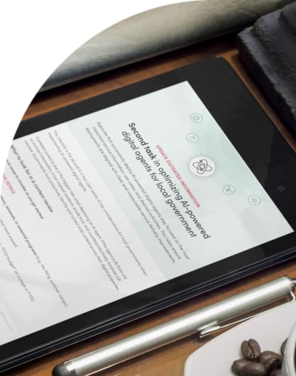 A tablet sitting on a desk next to a pen and cup of coffee, open to a Granicus checklist titled, 