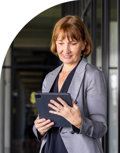 Elected official using a tablet to manage constituent requests with Indigov digital service tools.

