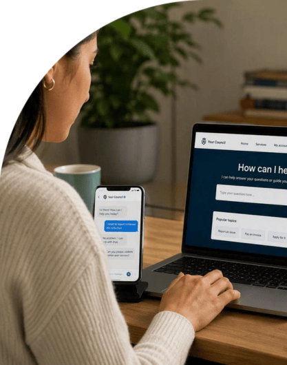 Person using a laptop and smartphone to access an AI-powered self-service support portal at a desk.