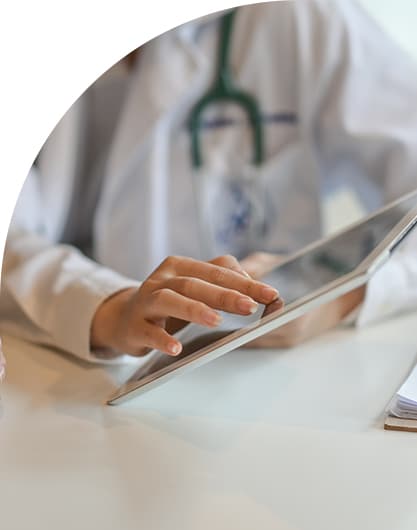 Shot of a doctor showing a patient some information on a tablet