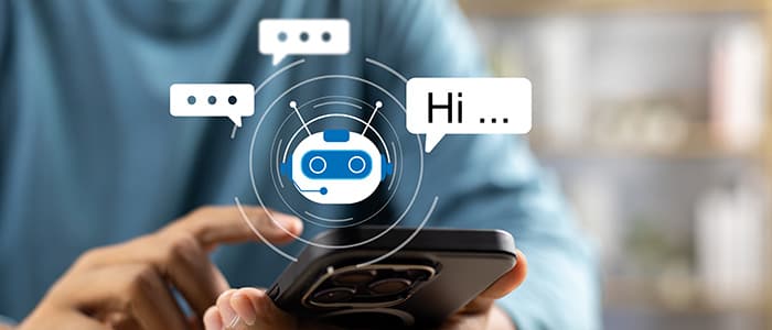 A person in a blue shirt holds a smartphone with a chatbot icon and speech bubbles saying 