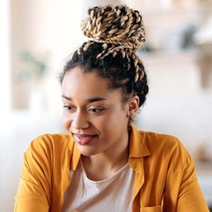Young African-American woman looking at her laptop screen