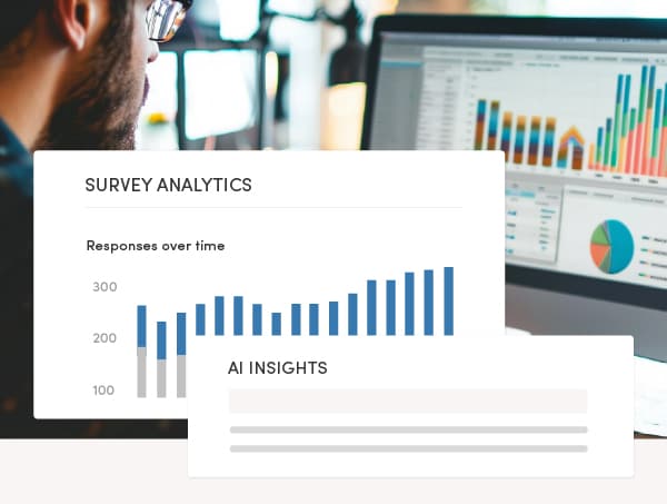 A person looks at a computer screen displaying colorful bar and pie charts. Overlay text reads 