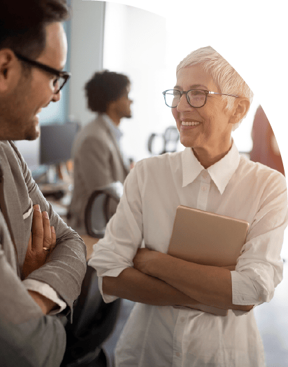 Two colleagues talking and collaborating in an office setting