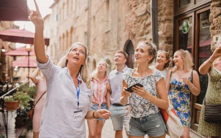 A group of tourists pointing at a historical location