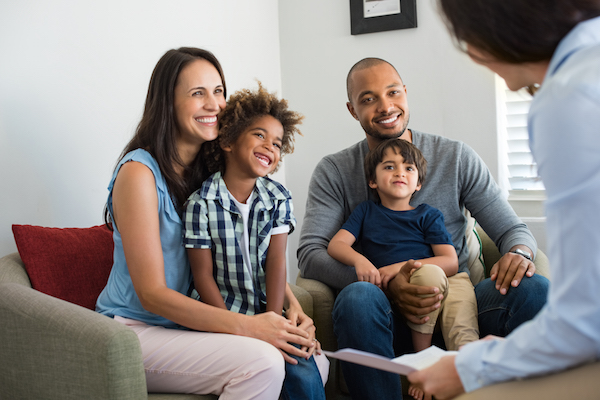 Michigan Department of Health and Human Services image Family talking with counselor