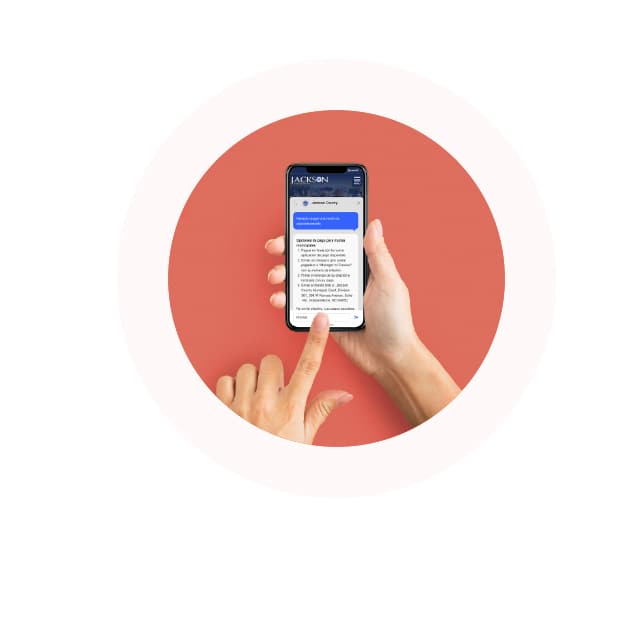 Hands holding a phone and interacting with Government Experience Agent on Jackson County government's website.