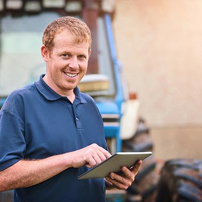 Man engaging with community online from farm