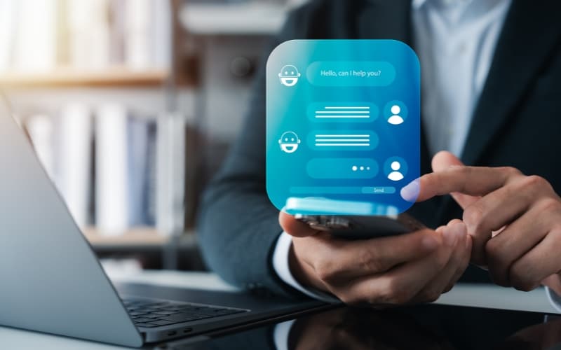 Person using a smartphone with an AI chatbot interface, representing the use of AI to improve public service.