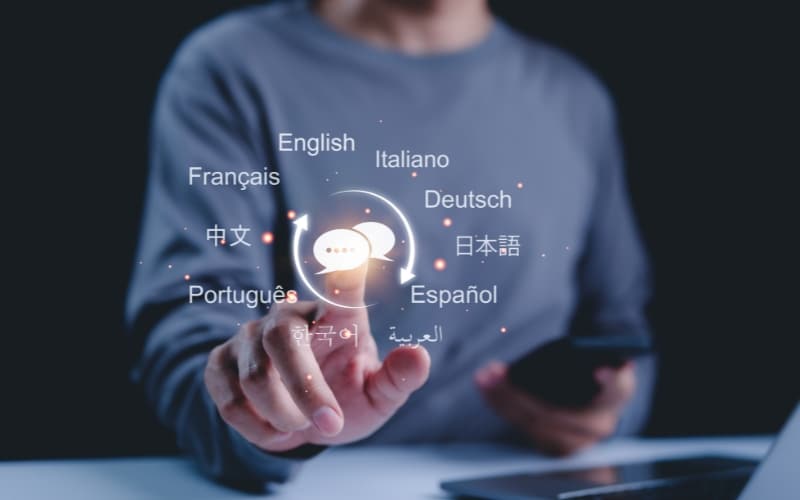 A person interacting with a digital interface displaying multiple languages, symbolizing global multilingual communication.