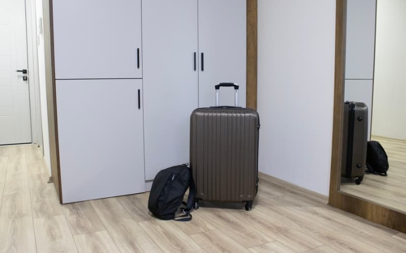 Suitcases in a modern rental unit, representing travel and the impact of local regulations on short‑term stays.
