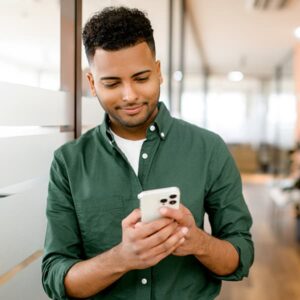 Male government employee reading about data-driven insights to transform government service delivery in the State of Digital Government Report