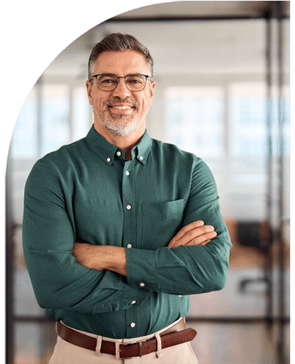 Proud government employee standing with his arms gently crossed and smiling