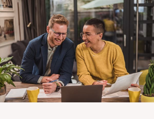 A male and female government employee collaborating on a Zoom call while receiving expert guidance and insights from Granicus' Customer Experience Services team.