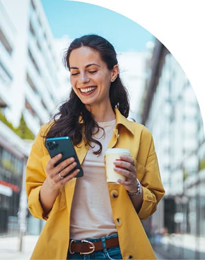 Woman smiling while receiving great service delivery on her phone