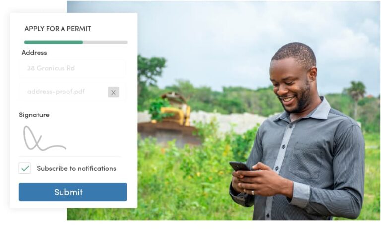 Man using his phone to submit a permitting request from a development site through a local government digital permitting system.