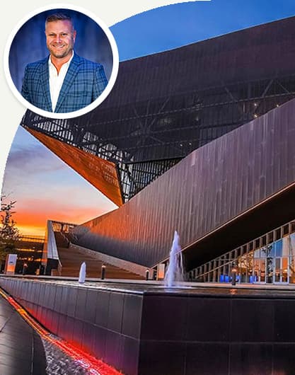 Monty white headshot over irving building