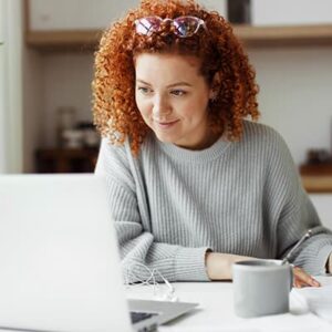 Government employee watching a webinar featuring award winning government organizations sharing insights on improving the government experience.